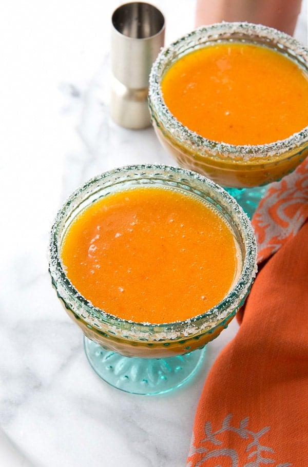 Persimmon Margaritas with Cinnamon Simple Syrup in blue glass