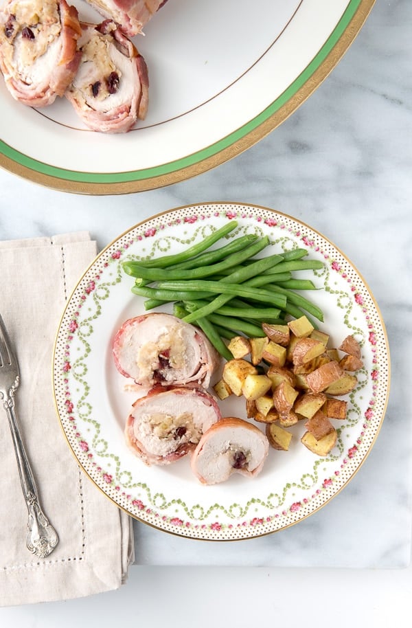 Turkey Roulade with Apple-Cranberry Stuffing and Bacon Weave with green beans and potatoes.