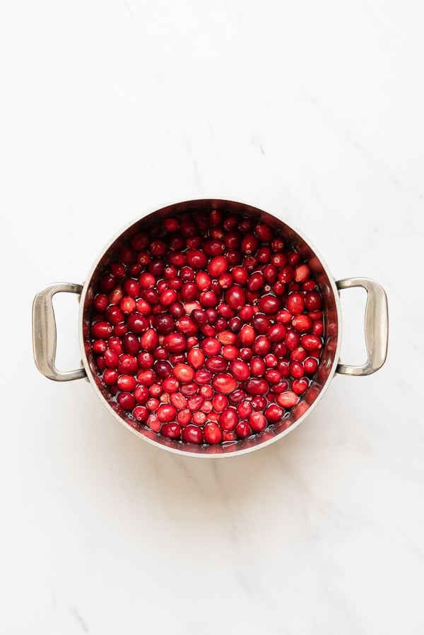 cranberries in a cooking pot with water