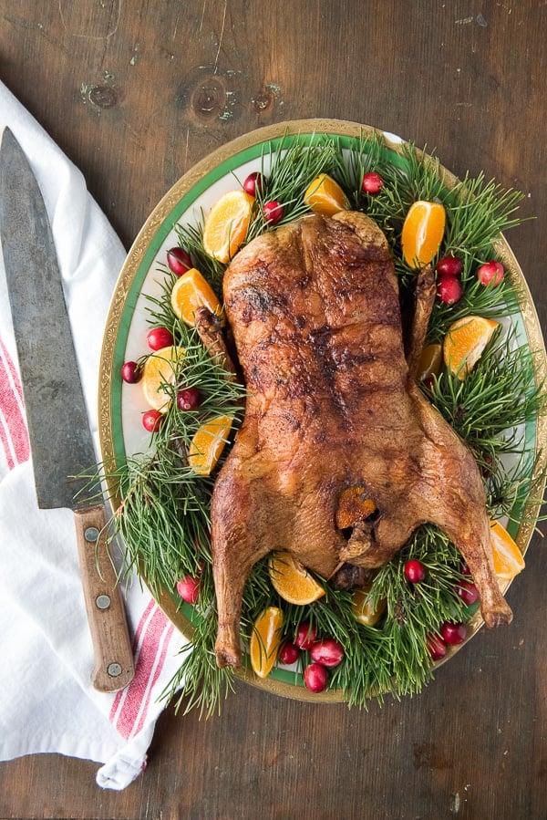Easy Roast Whole Duck with Chinese Five Spice on platter with greens