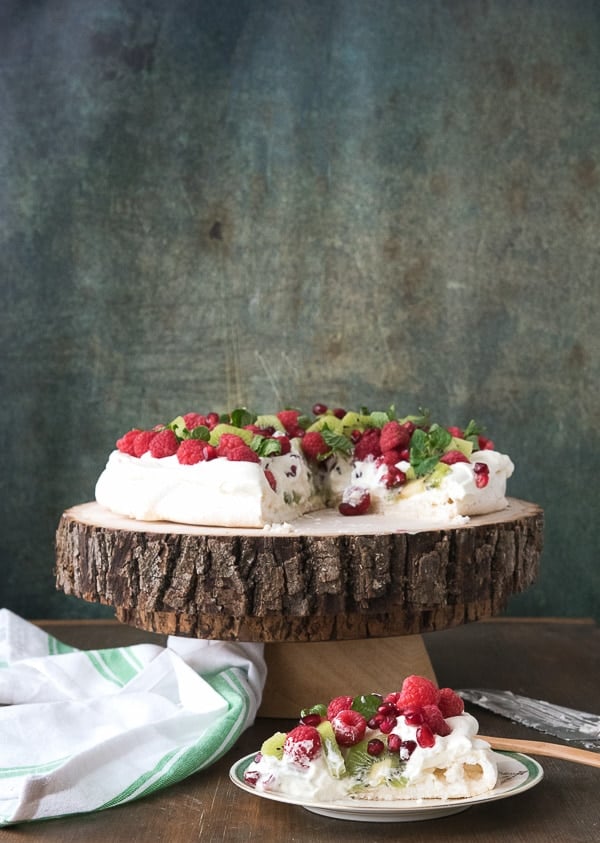 Pavlova with Kiwi, Raspberry, Pomegranate and Mint sliced