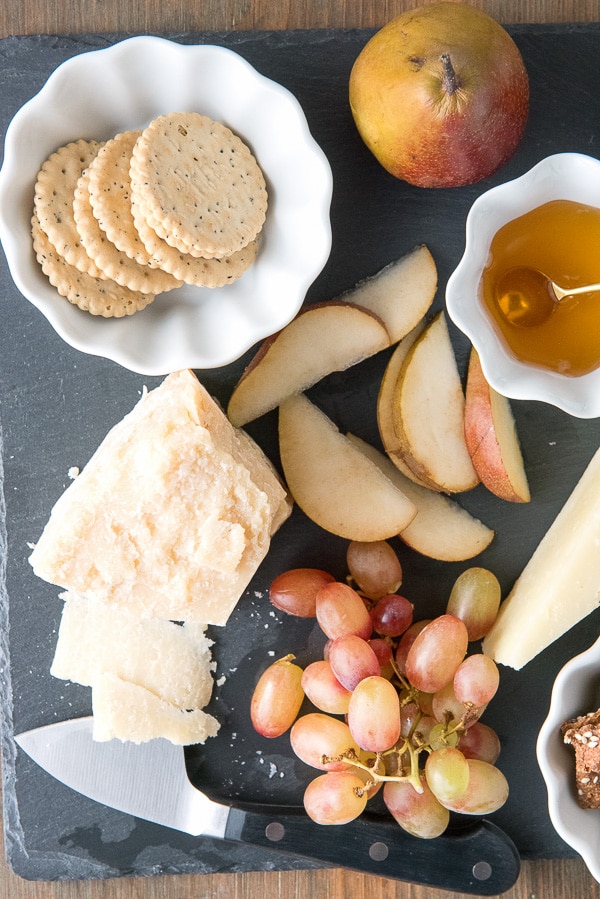 Seeded gluten-free crackers, Parmigiano-Reggiano cheese, grapes, Seckel pears and honey 