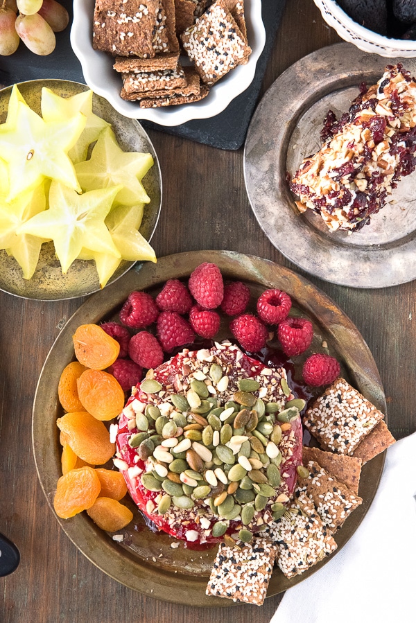 Spicy Cranberry-Raspberry Baked Brie with Toasted Hazelnuts and Pepitas 