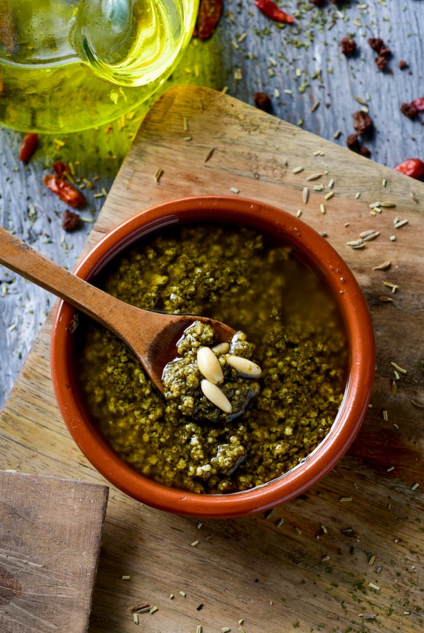 Fresh basil pesto recipe in red bowl