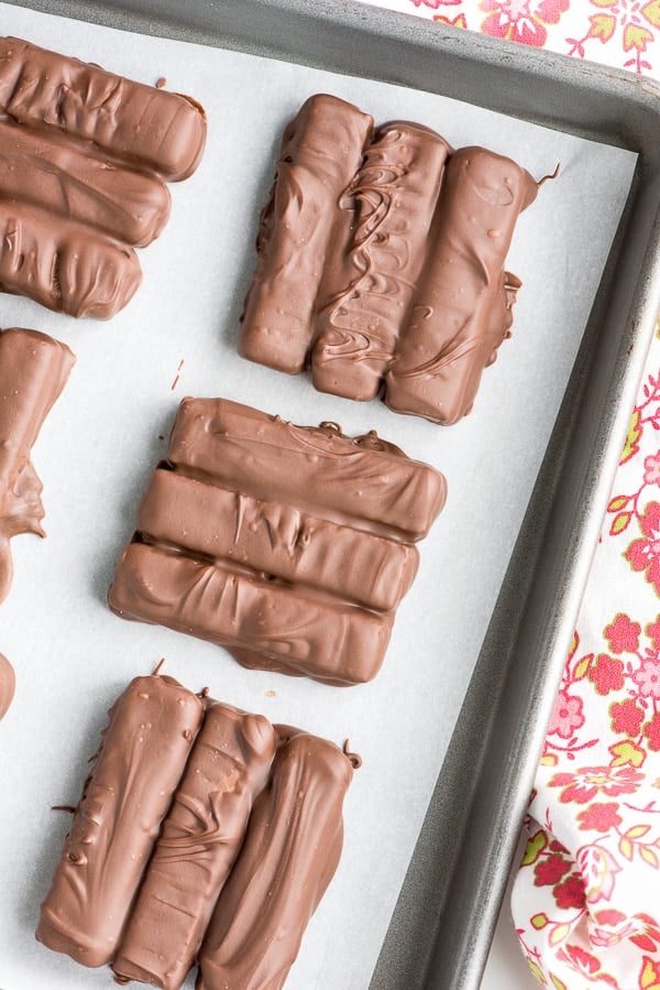 overhead photo of Double Chocolate Copycat Kit Kat Bars on a parchment paper lined baking pan