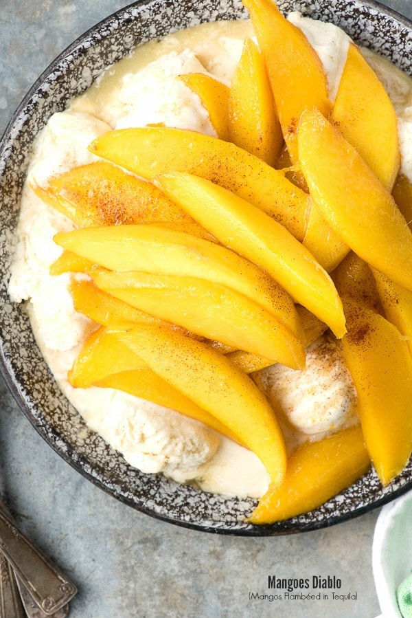 overhead photo of Mangoes Diablo (mangos flambéed in tequila) over Vanilla Ice Cream