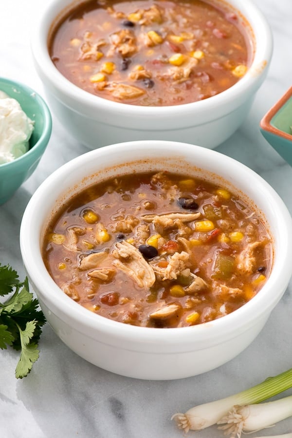 Slow Cooker Mexican Chicken and Rice Soup. This easy, hearty soup is filled with chicken, black beans, corn, tomatoes, rice and spicy broth