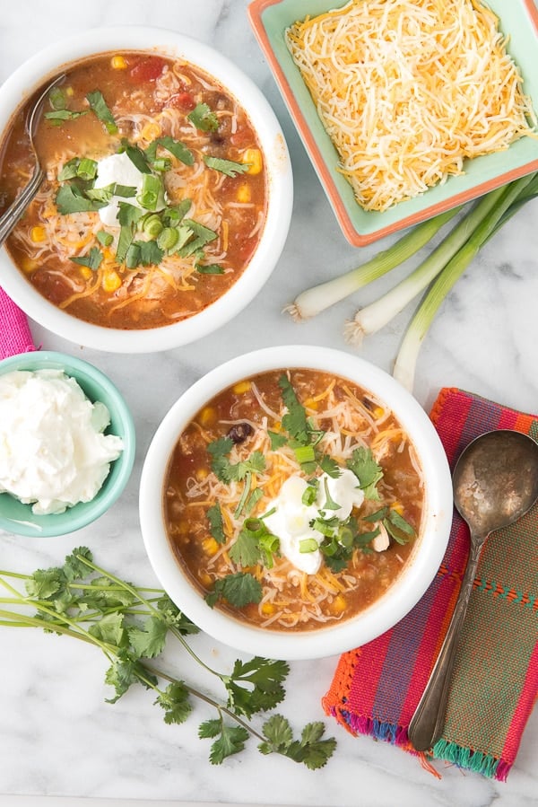 Slow Cooker Mexican Chicken and Rice Soup in white bowls