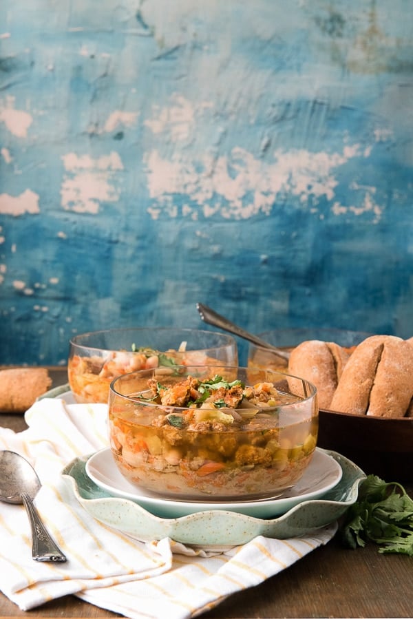 Clear bowl filled with Slow Cooker Spicy Chorizo Green Chile Cannellini Bean Soup