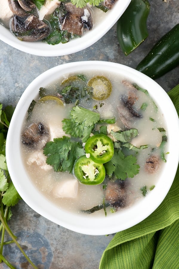 close up photo of a bowl of Thai Chicken Mushroom Coconut Soup