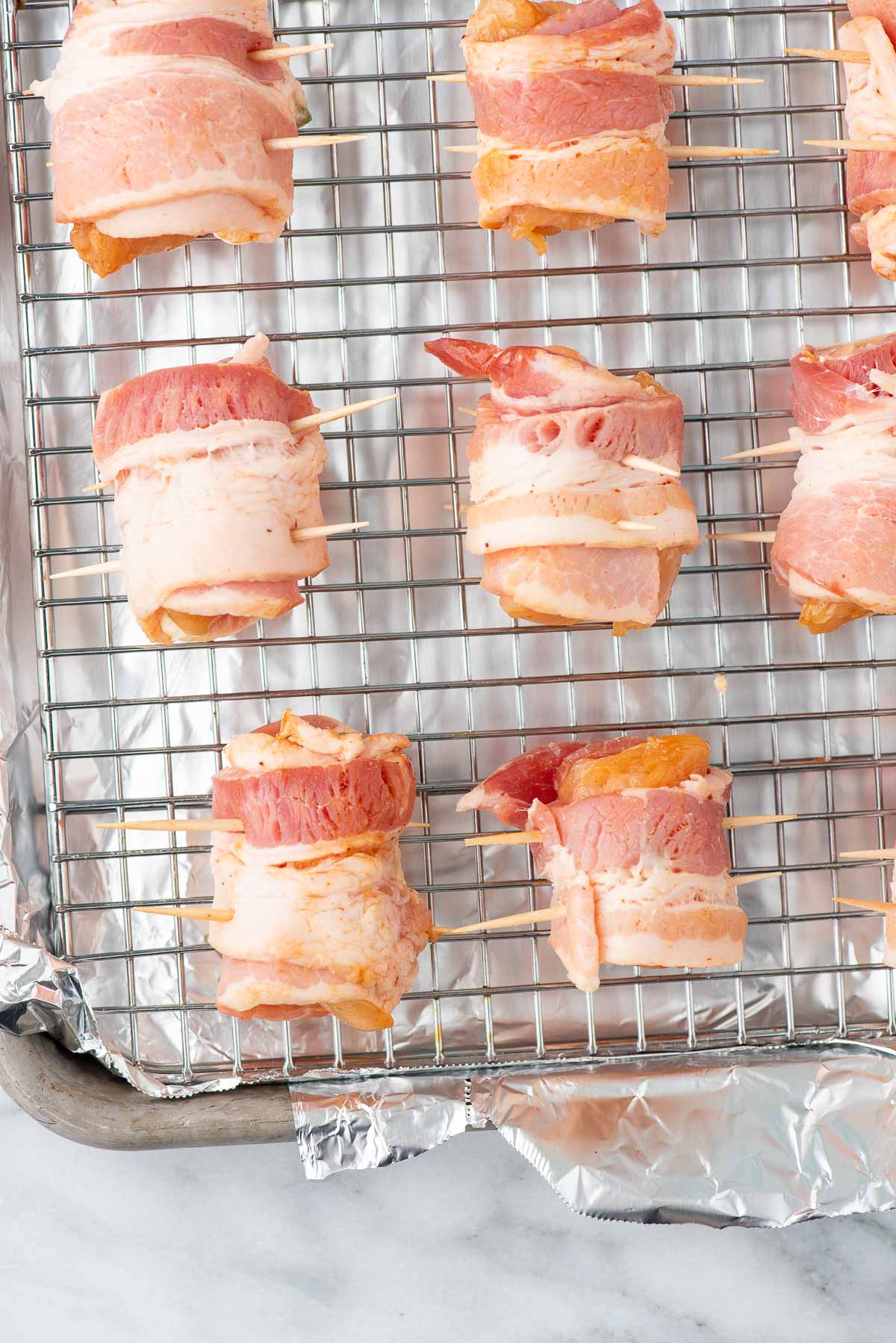 chicken jalapeno poppers on wire rack overhead 