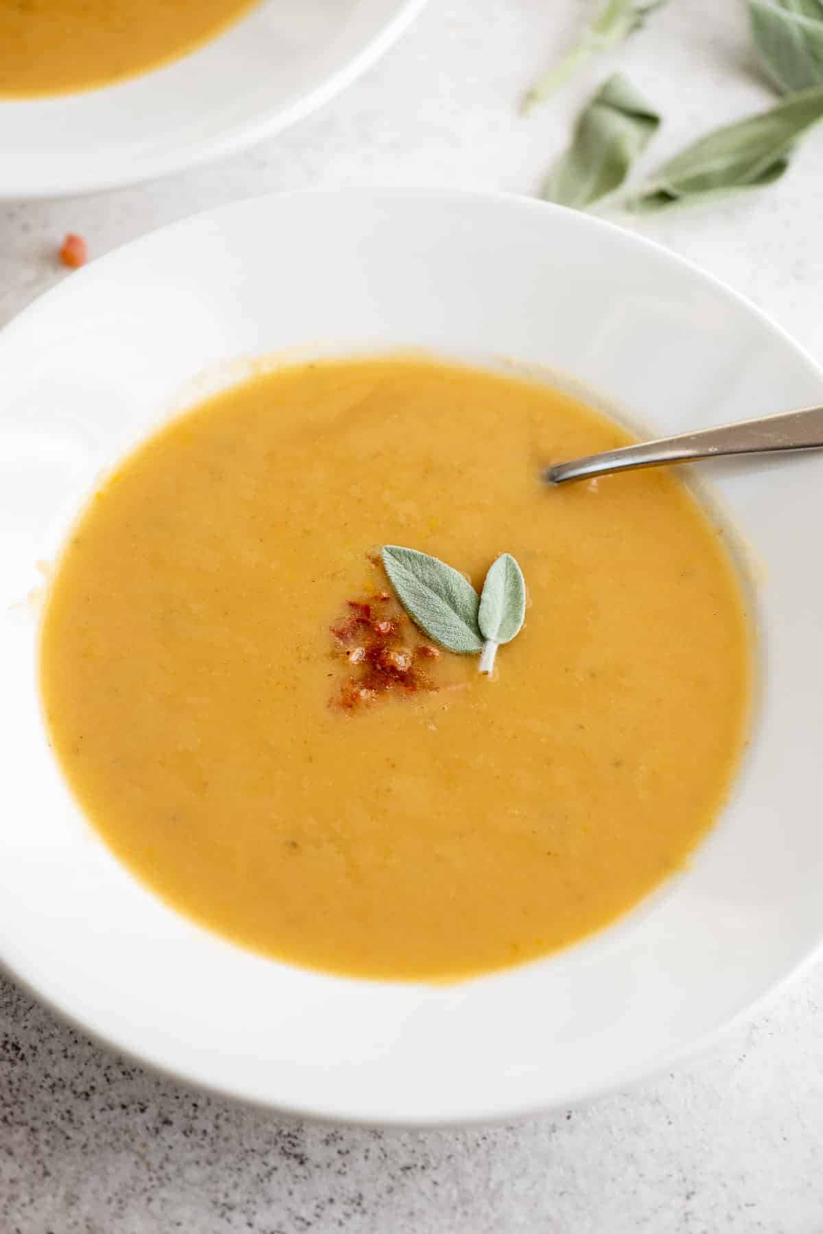roasted pumpkin cannellini soup in white bowl