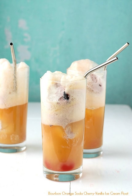 Cocktail ice cream floats for adults: Orange Soda Bourbon Cherry-Vanilla Ice Cream Floats with a great tip on how to pre-freeze the ice cream balls for easy cocktail preparation. Super easy to make. Makes any event a party!