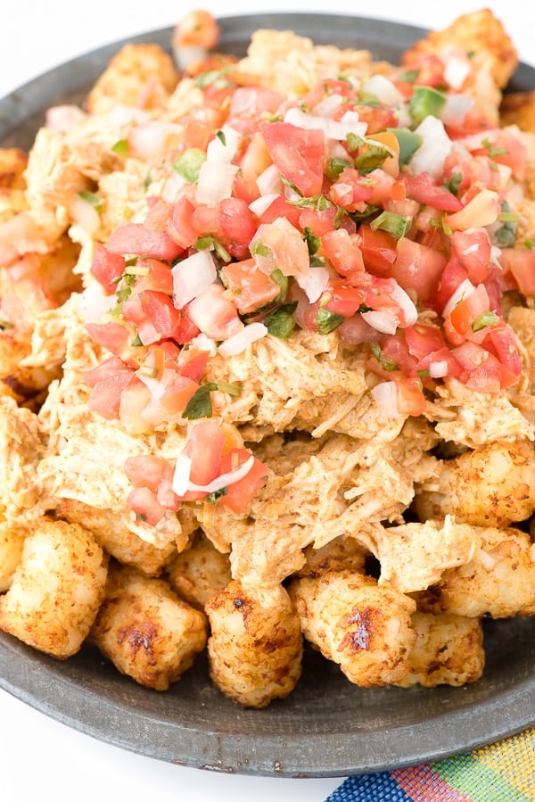 Green Chile Chicken Totchos topped with fresh pico de gallo salsa