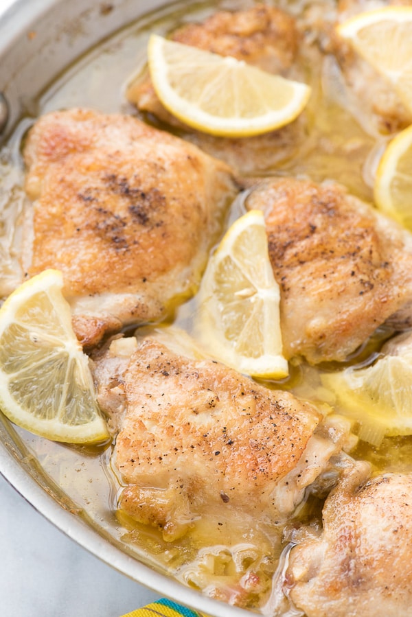 A close up of a plate of Lemon-Garlic Chicken Thighs