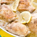 Irresistible Lemon-Garlic Braised Chicken Thighs (close up) in silver skillet