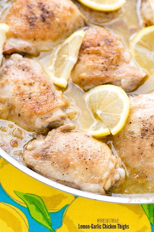 Irresistible Lemon-Garlic Braised Chicken Thighs (close up) in silver skillet