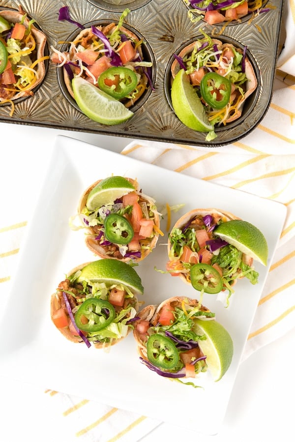 overhead photo of a square white plate holding 4 Muffin Tin Mexican Bowls