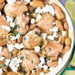 One Pot Greek Chicken Thighs shown in a Dutch oven