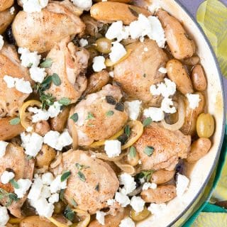 One Pot Greek Chicken Thighs shown in a Dutch oven