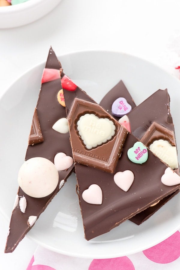 Small white plate of Valentine\'s candy chocolate bark