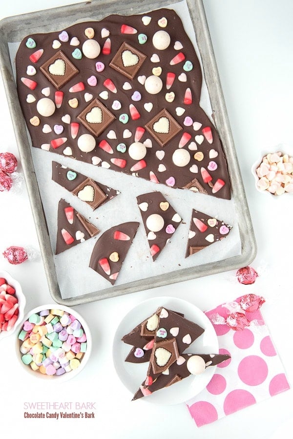 Rimmed baking sheet of Sweetheart Bark Valentine's Candy Chocolate Bark and candies