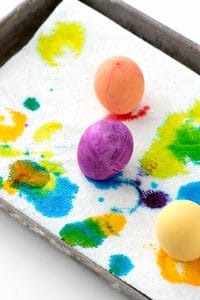 Dyed artificial eggs draining on paper towel