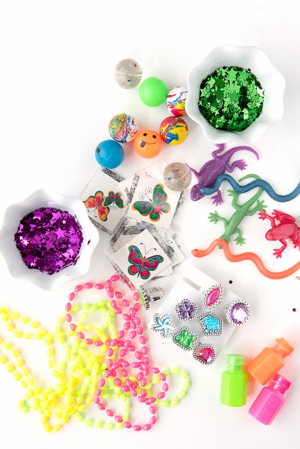 assortment of small toys, trinkets and confetti to fill Cascarones confetti eggs