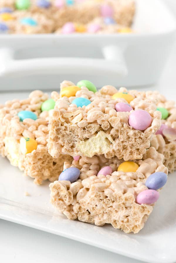 white plate of pastel colored Crispy Rice Cereal marshmallow treats