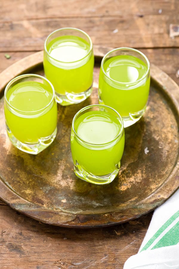 Lucky Leprechaun Shots (a fruity shot cocktail) on a bronze tray