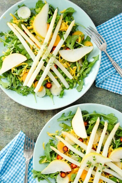 2 mint green plates with White Asparagus Arugula Spring Salad with Meyer Lemon White Balsamic Dressing