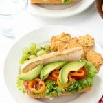 2 plates with Southwestern Sub Sandwiches full of chipotle mayonnaise, turkey, fresh vegetables, and pepper jack cheese.