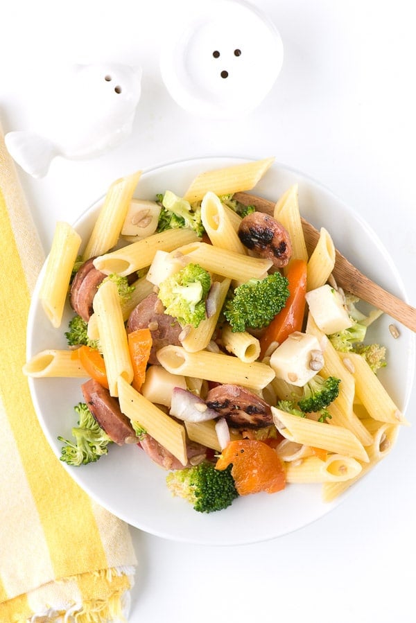 overhead image of a white plate of Broccoli Sausage Pasta Salad