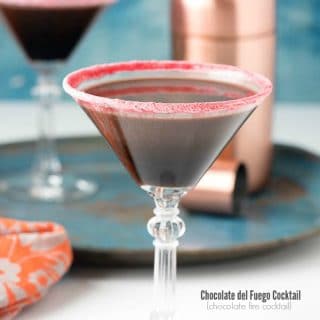 Chocolate del Fuego - creamy chocolate cocktail in a glass rimmed with crushed cinnamon candies