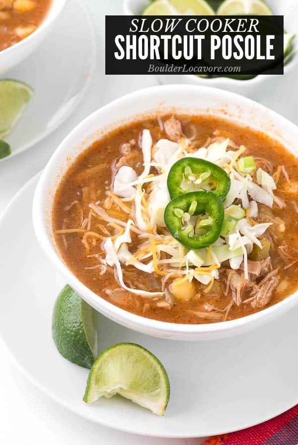 Posole in a white bowl with toppings title