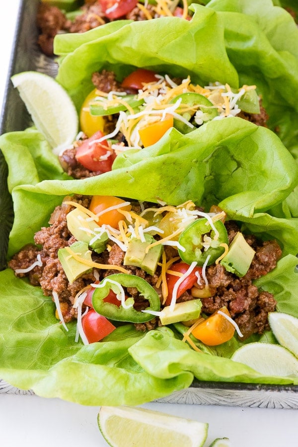 Two taco lettuce wraps with toppings