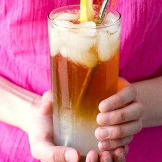 an Arnold Palmer drink held in girl's hands