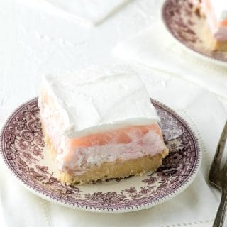 plated slice of fluffy strawberry cheesecake dessert 'lasagna'