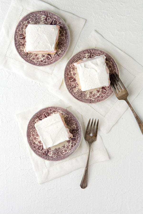 overhead image of 3 plates of Fluffy No-Bake Strawberry Cheesecake Dessert Lasagna