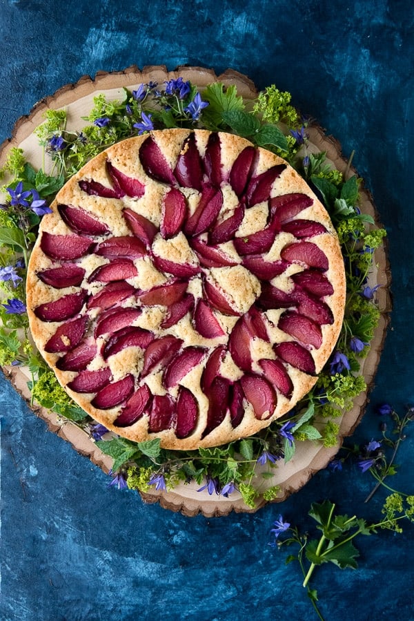 Rustic Plum Cake on wood slab