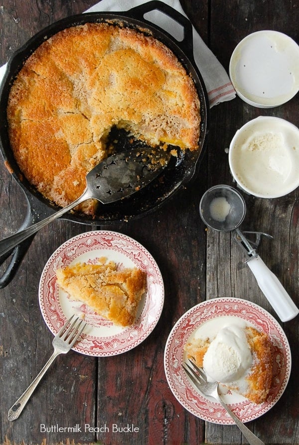 overhead view of  Buttermilk Peach Buckle in skillet and slices on plates