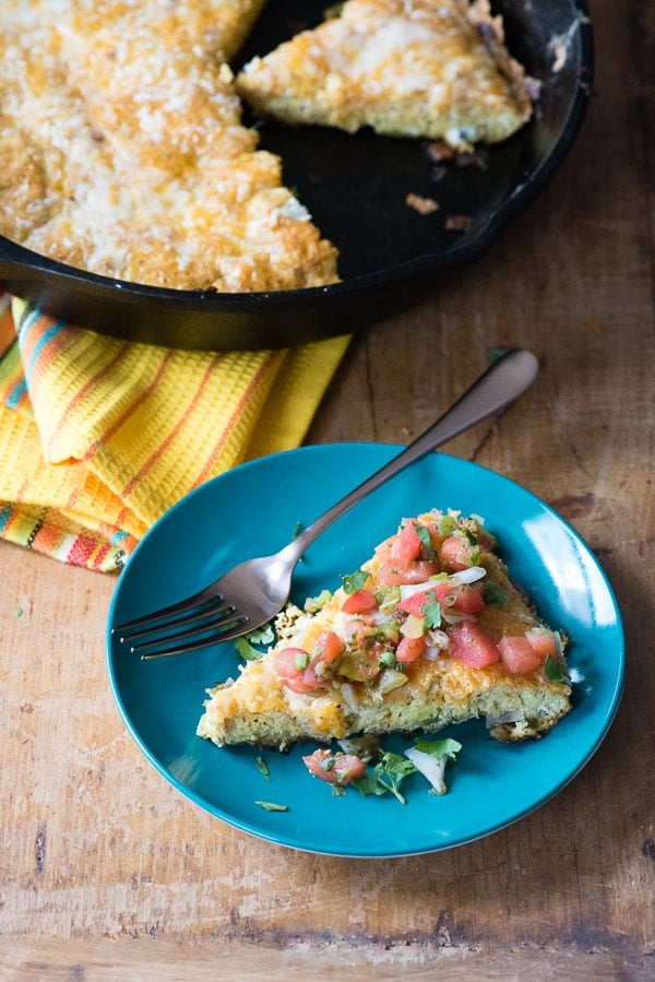 slice of Mexican frittata on a blue plate with fork