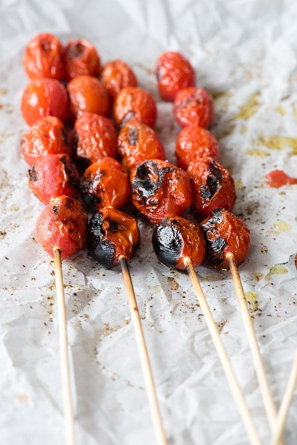 Blistered tomatoes on skewers