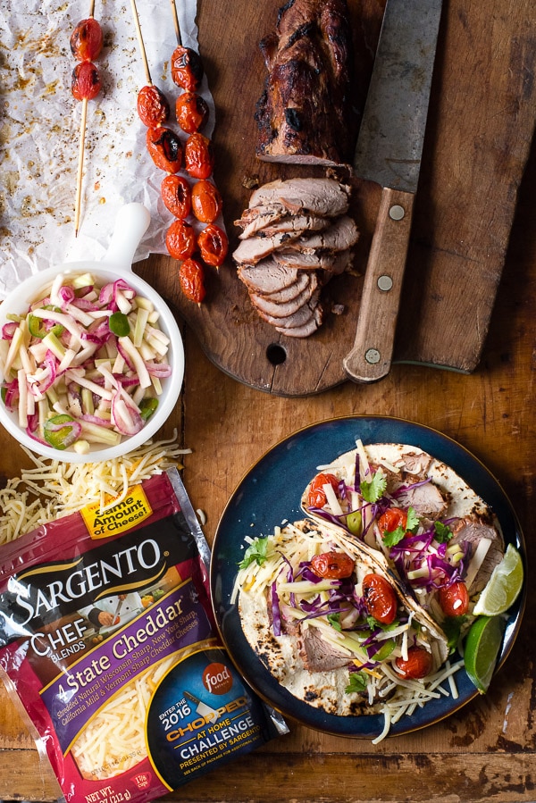 A bowl of food on a table, with Taco and Pork