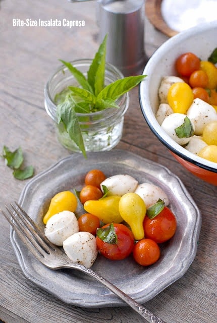 Bite-size Insalata Caprese on pewter plates