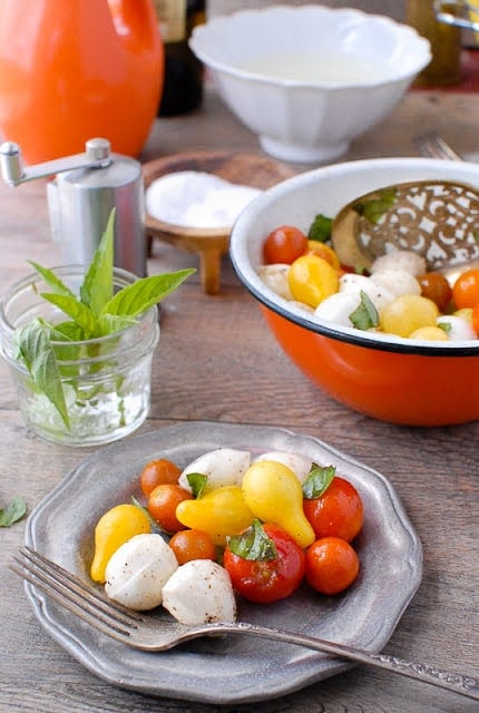 Bite-size Insalata Caprese.On plate and in bowl