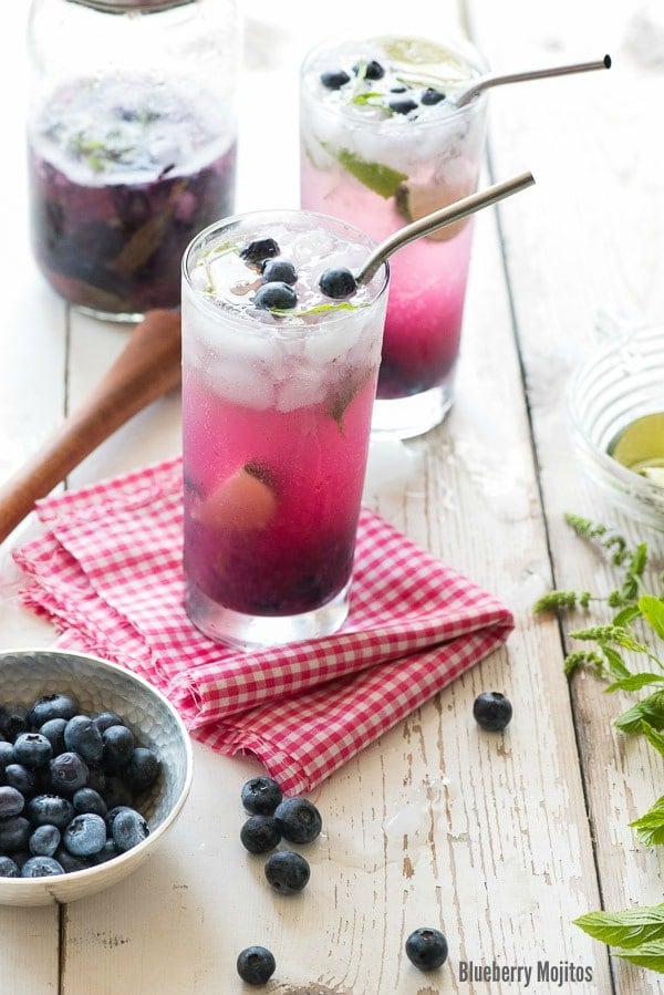  Blueberry Mojitos with metal straw on checked cloth