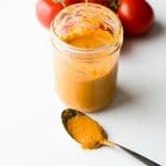 Roasted Tomato Dressing in jar with spoon