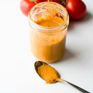 Roasted Tomato Dressing in jar with spoon