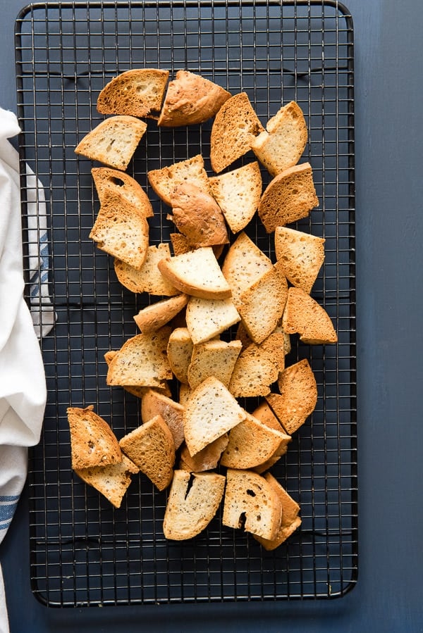 Homemade Everything Bagel Chips on black wire cooking rack